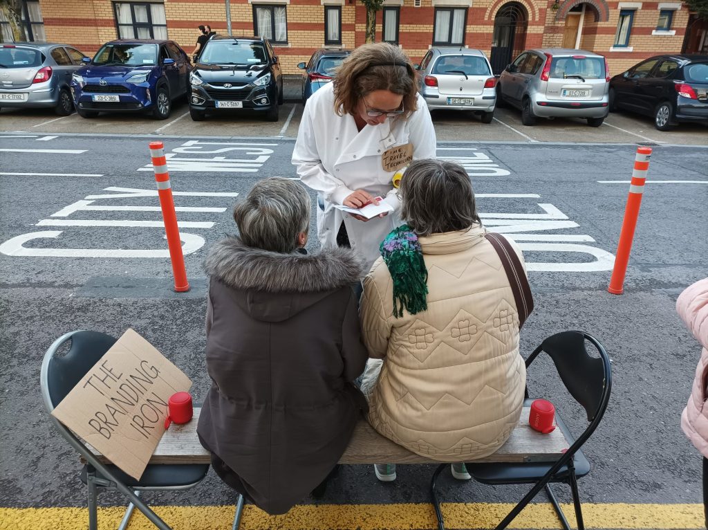 Cork Folklore Project member explaining the project to two enthusiastic members of the public for Culture Night 